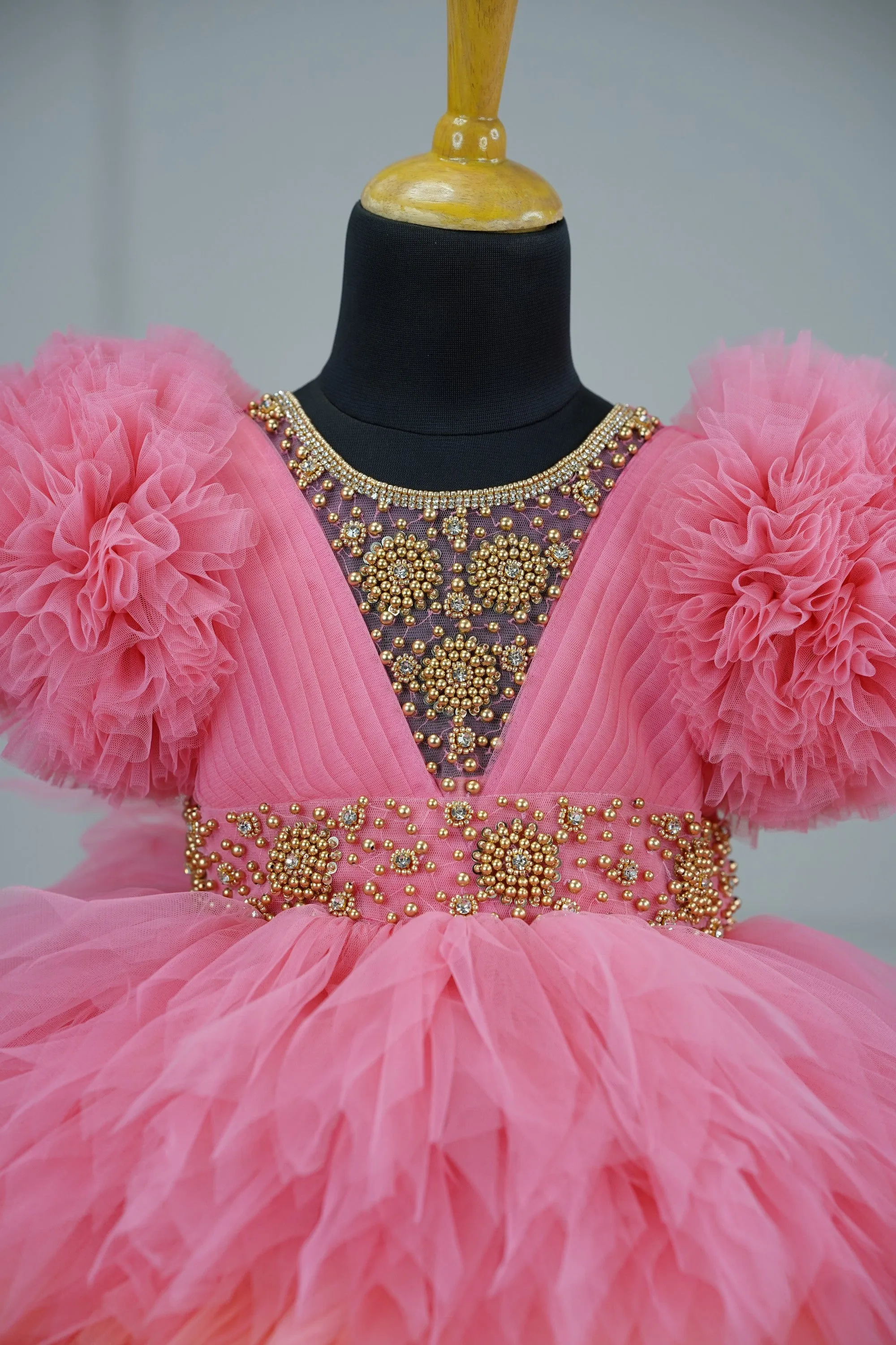 Pre-Order:  Flamingo Pink And Light Peach Feather Frilled Gown With Rich Golden Bead Work Gown